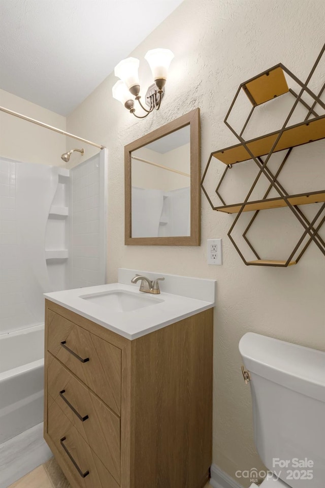 full bathroom featuring vanity, toilet, and washtub / shower combination