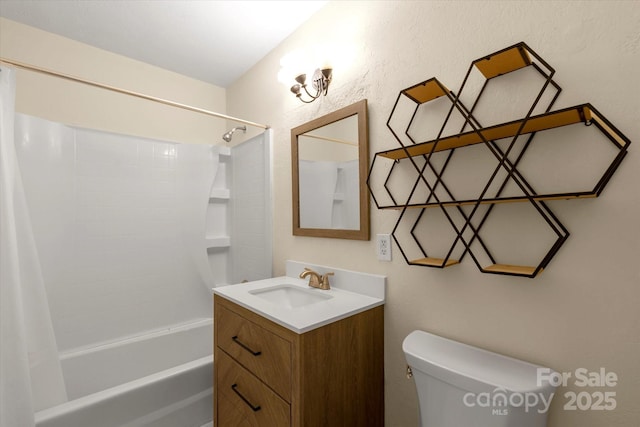 full bathroom featuring shower / tub combo, vanity, and toilet