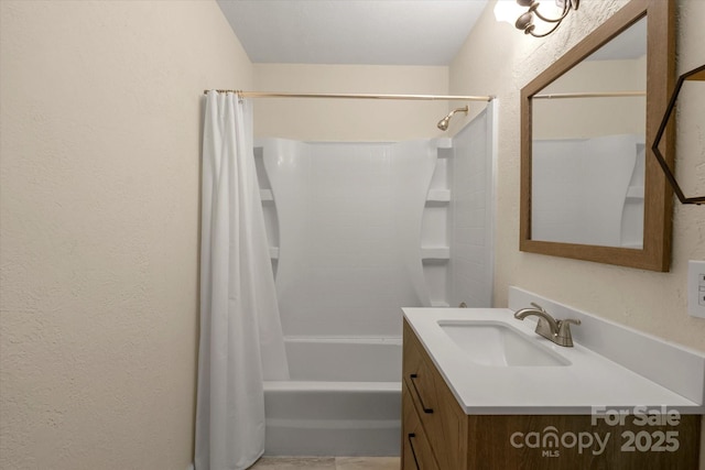 bathroom featuring vanity and shower / bathtub combination with curtain