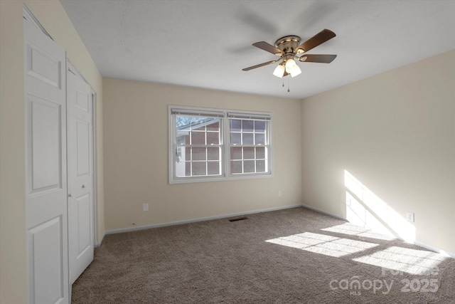 unfurnished bedroom with carpet and ceiling fan