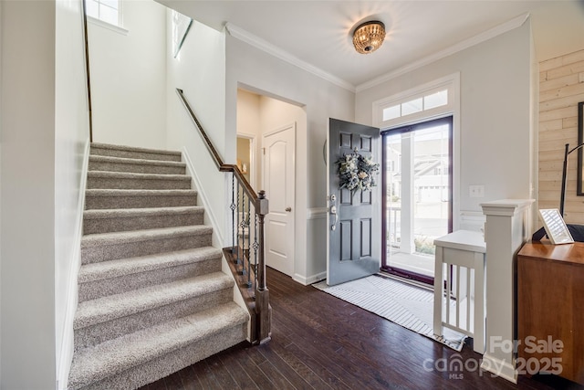 foyer entrance featuring dark hardwood / wood-style flooring and ornamental molding