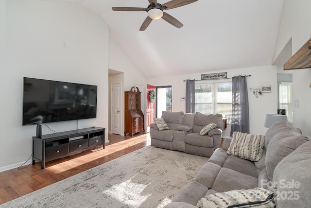 living room featuring hardwood / wood-style floors, high vaulted ceiling, and ceiling fan