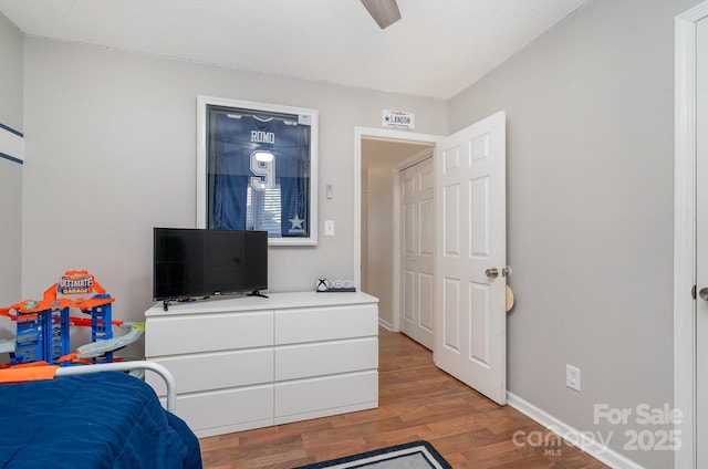 bedroom featuring light hardwood / wood-style flooring and ceiling fan