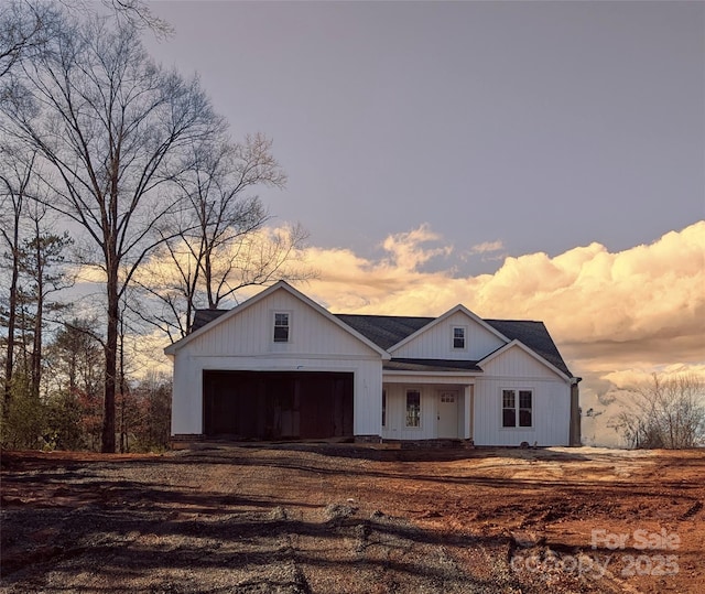 modern farmhouse style home featuring a garage