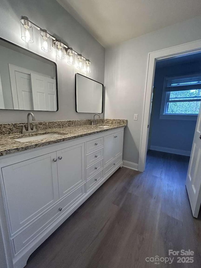 bathroom featuring hardwood / wood-style floors and vanity