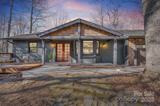 back house at dusk with french doors