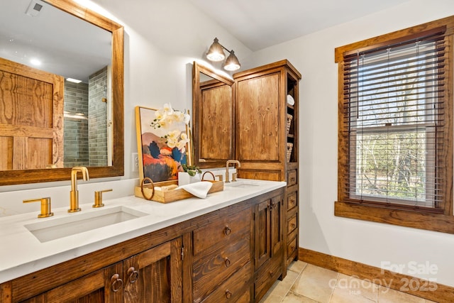 bathroom with tile patterned flooring, vanity, and a shower with door