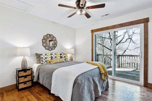 bedroom featuring access to exterior, ceiling fan, and dark wood-type flooring