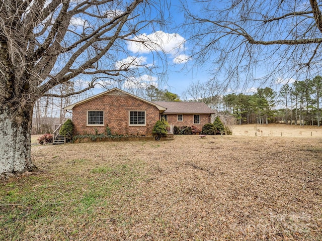 ranch-style home with a front yard