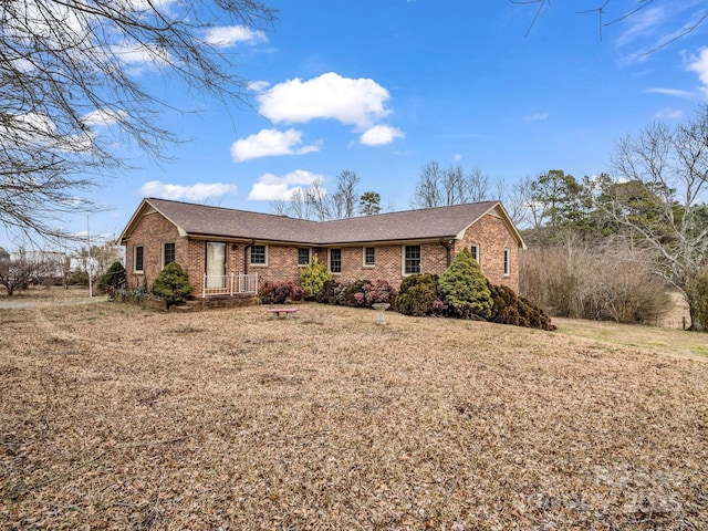 ranch-style house with a front yard