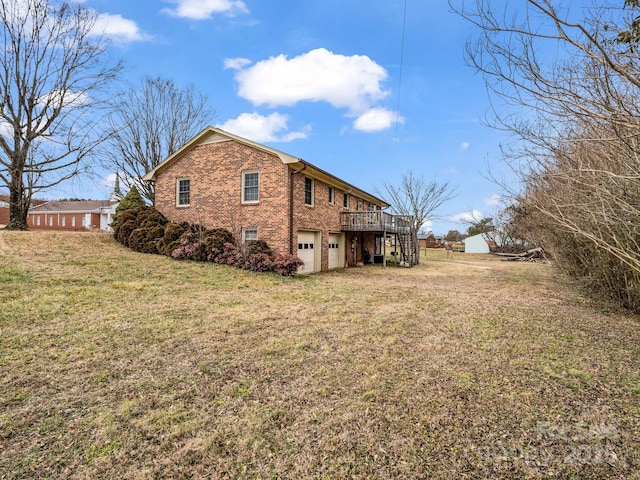 view of property exterior with a wooden deck, a garage, and a yard