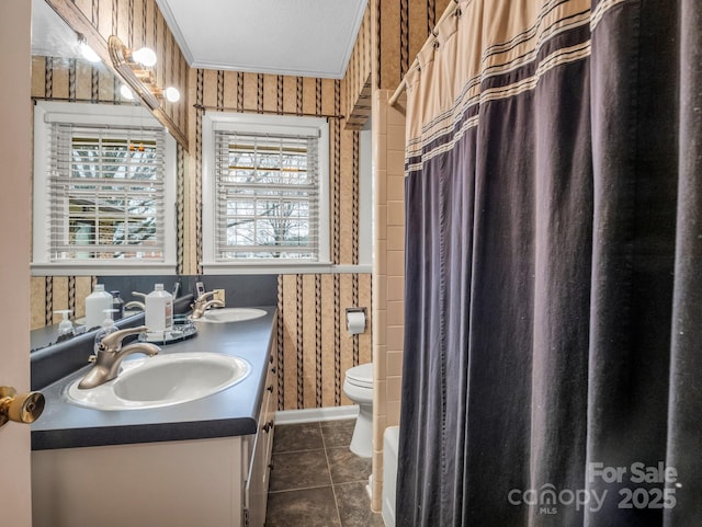 bathroom with vanity, plenty of natural light, tile patterned floors, and toilet