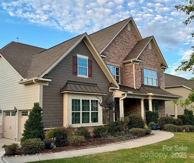 craftsman house with a garage