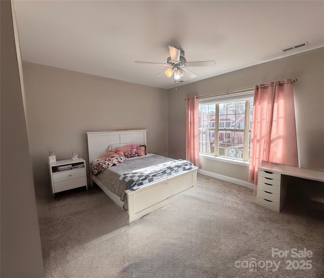 bedroom featuring ceiling fan and carpet