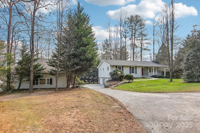 single story home with a front yard and a carport