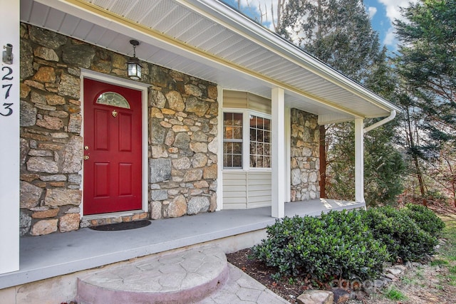 property entrance with covered porch