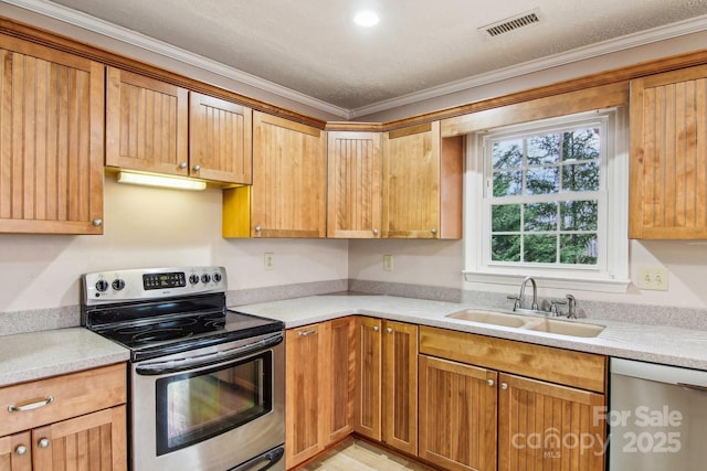 kitchen with sink, stainless steel appliances, and ornamental molding