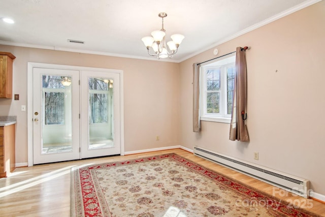 doorway to outside featuring light wood-type flooring, an inviting chandelier, a baseboard heating unit, and crown molding