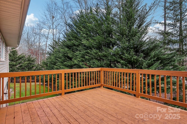 deck featuring a lawn