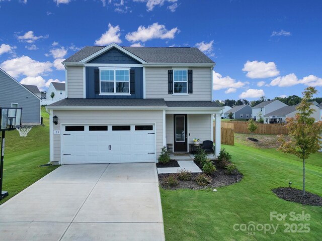 front facade with a garage and a front lawn