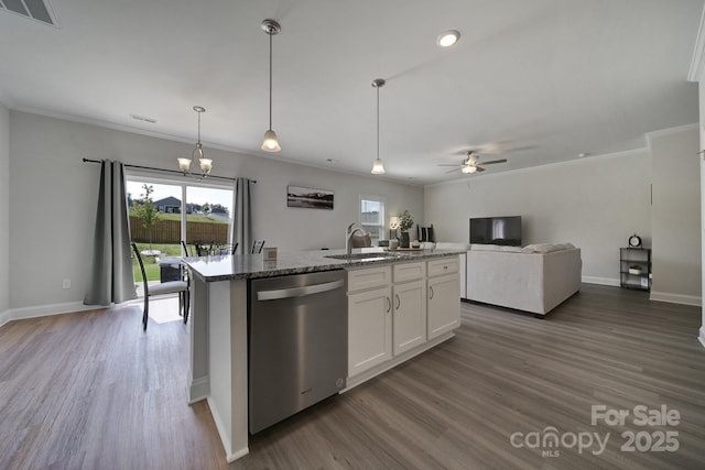 kitchen featuring stone counters, a center island with sink, sink, stainless steel dishwasher, and white cabinetry