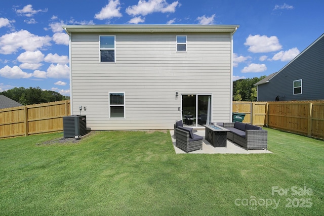 rear view of house with a patio, an outdoor living space with a fire pit, cooling unit, and a lawn