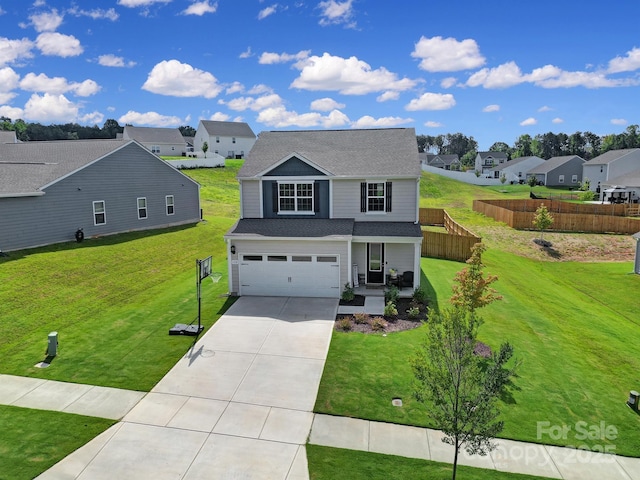 view of front property with a garage and a front lawn