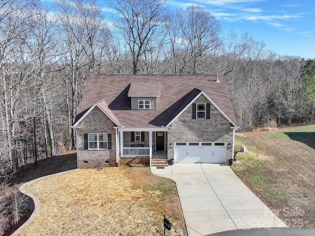 view of front facade featuring a porch, a garage, and a front yard