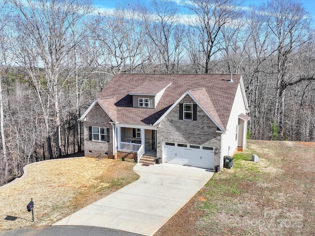 view of front of property with covered porch, a garage, and a front lawn