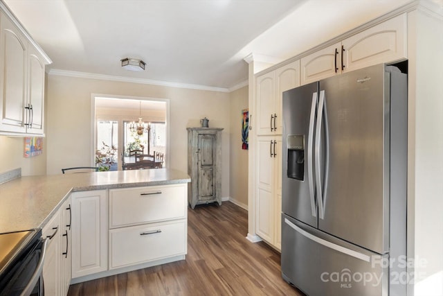 kitchen with ornamental molding, appliances with stainless steel finishes, dark hardwood / wood-style floors, and kitchen peninsula