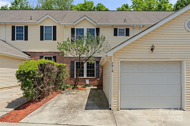 7019 Walnut Ridge Ct, Charlotte, NC 28217 - view of front facade with brick siding and an attached garage