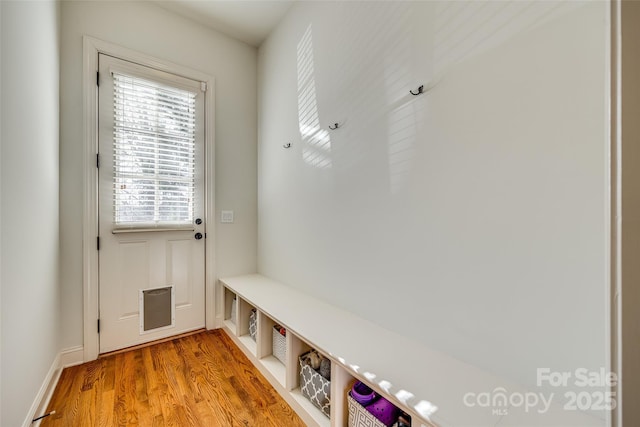 mudroom with light hardwood / wood-style flooring