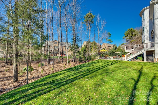 view of yard featuring a wooden deck