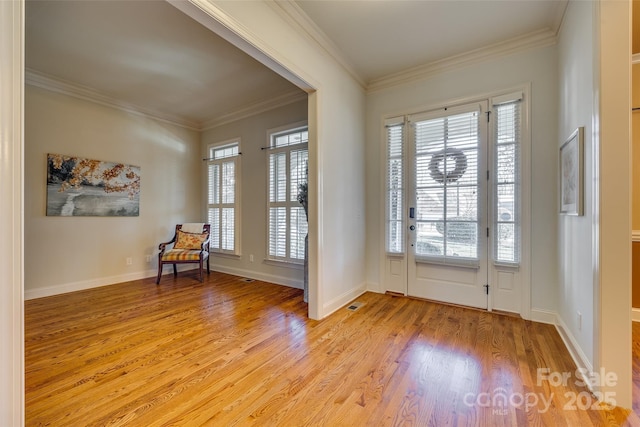 doorway with crown molding and light wood-type flooring