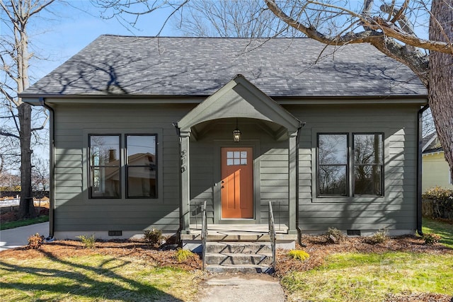 view of front of house featuring crawl space and roof with shingles