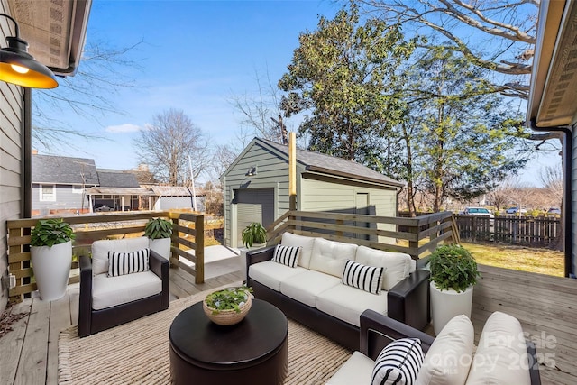 wooden deck with outdoor lounge area and an outbuilding