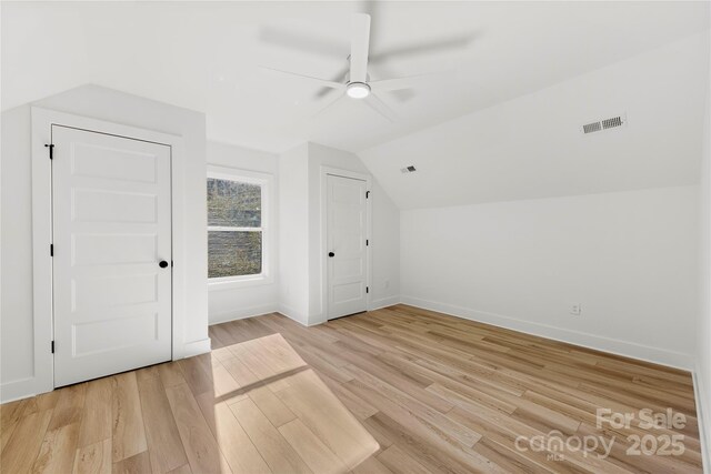 bonus room with visible vents, baseboards, ceiling fan, lofted ceiling, and light wood-style floors