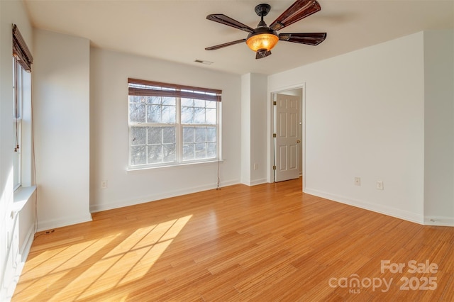 unfurnished room featuring ceiling fan and light hardwood / wood-style floors