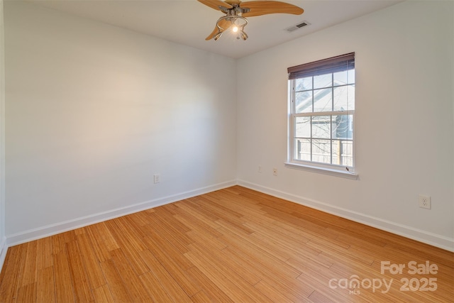 spare room featuring ceiling fan and light wood-type flooring