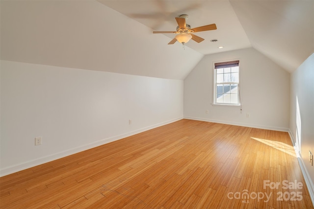 bonus room featuring vaulted ceiling, ceiling fan, and light wood-type flooring