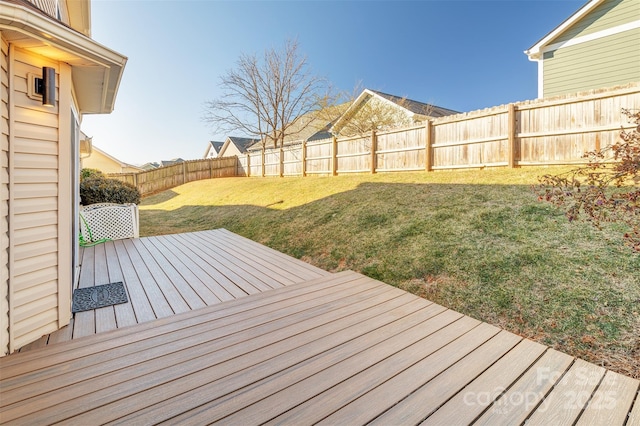 wooden deck with a lawn