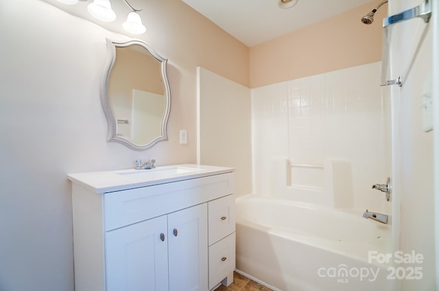 bathroom featuring shower / bathing tub combination and vanity