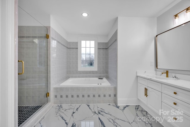 bathroom with vanity and separate shower and tub