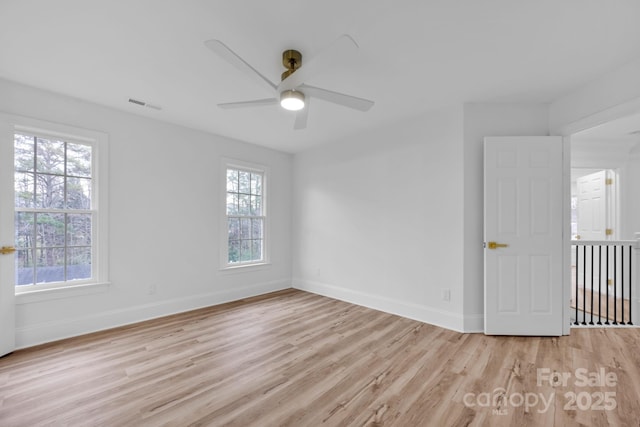 spare room with ceiling fan and light hardwood / wood-style flooring