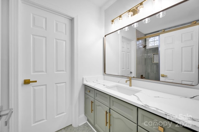 bathroom with vanity, a shower with door, and tile patterned floors