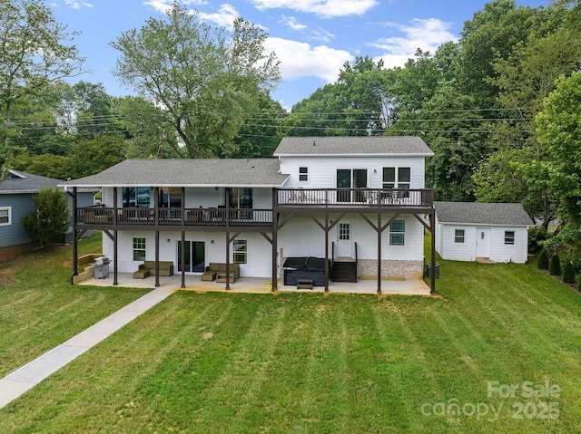 rear view of house featuring outdoor lounge area, a yard, and a patio