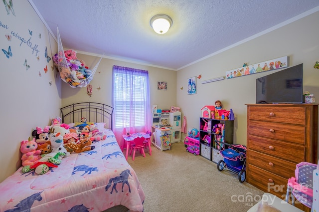 carpeted bedroom with ornamental molding and a textured ceiling