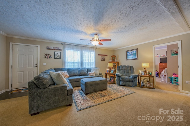 living room featuring carpet flooring, a textured ceiling, ceiling fan, and ornamental molding