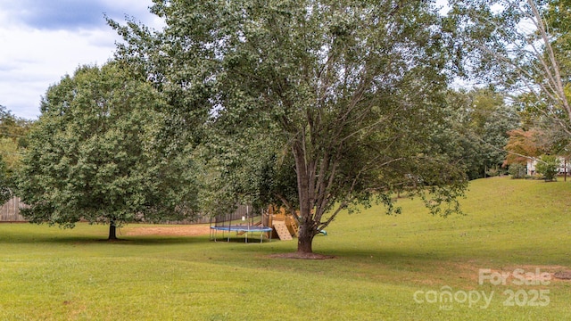 view of yard with a trampoline