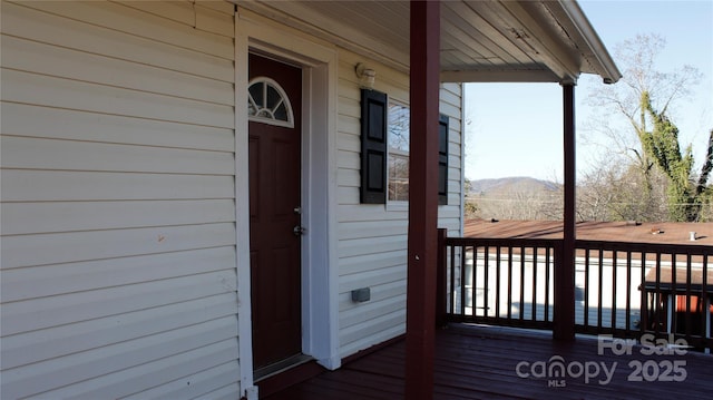 wooden terrace with a mountain view